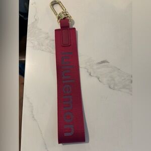 Lululemon pink key chain. Excellent condition!